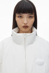 Alexander Wang white puffer coat with dome logo patch